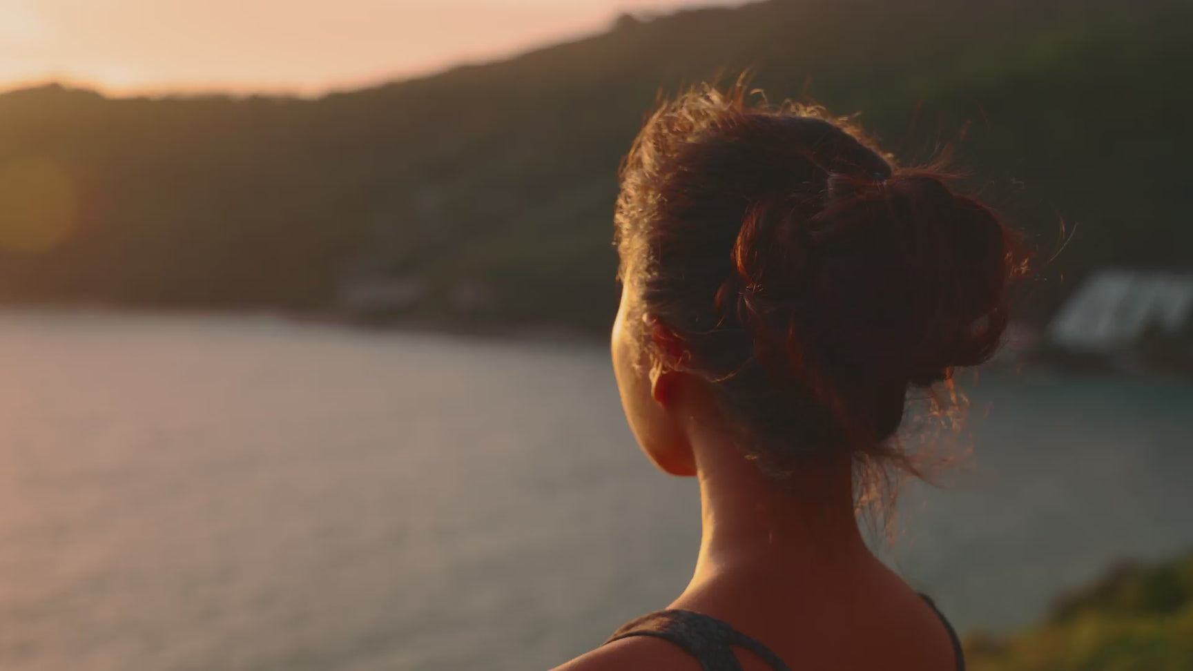 a woman looking at the water